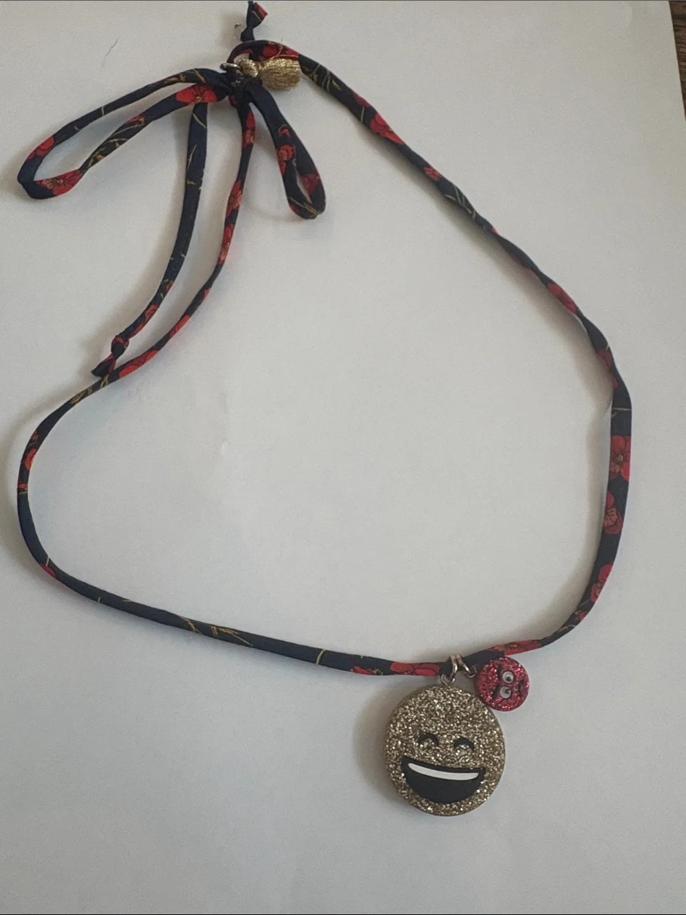 Crewcuts emoji necklace on Liberty of London fabric